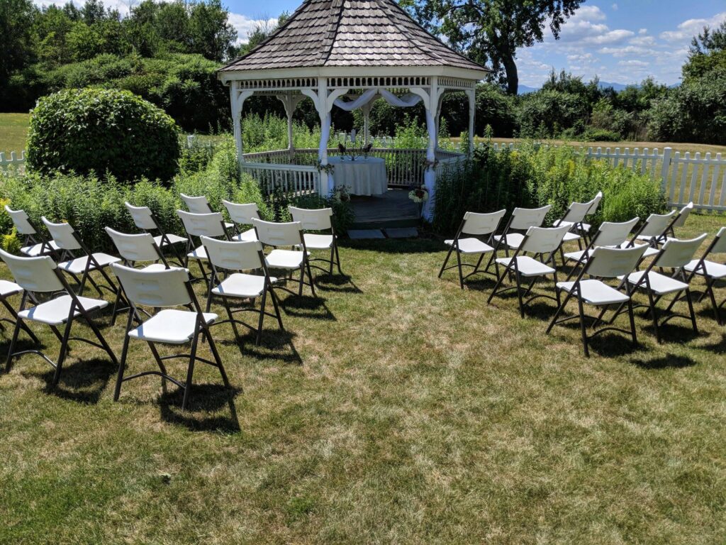 Ceremony set up with a gazebo in a garden