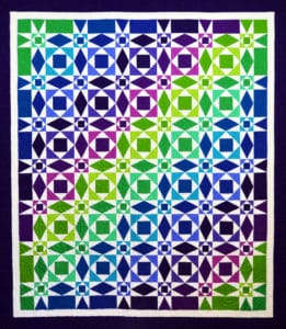 Quilt with blue, green and purple tones