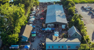 Lots of people and food trucks at a Burlington Warehouse