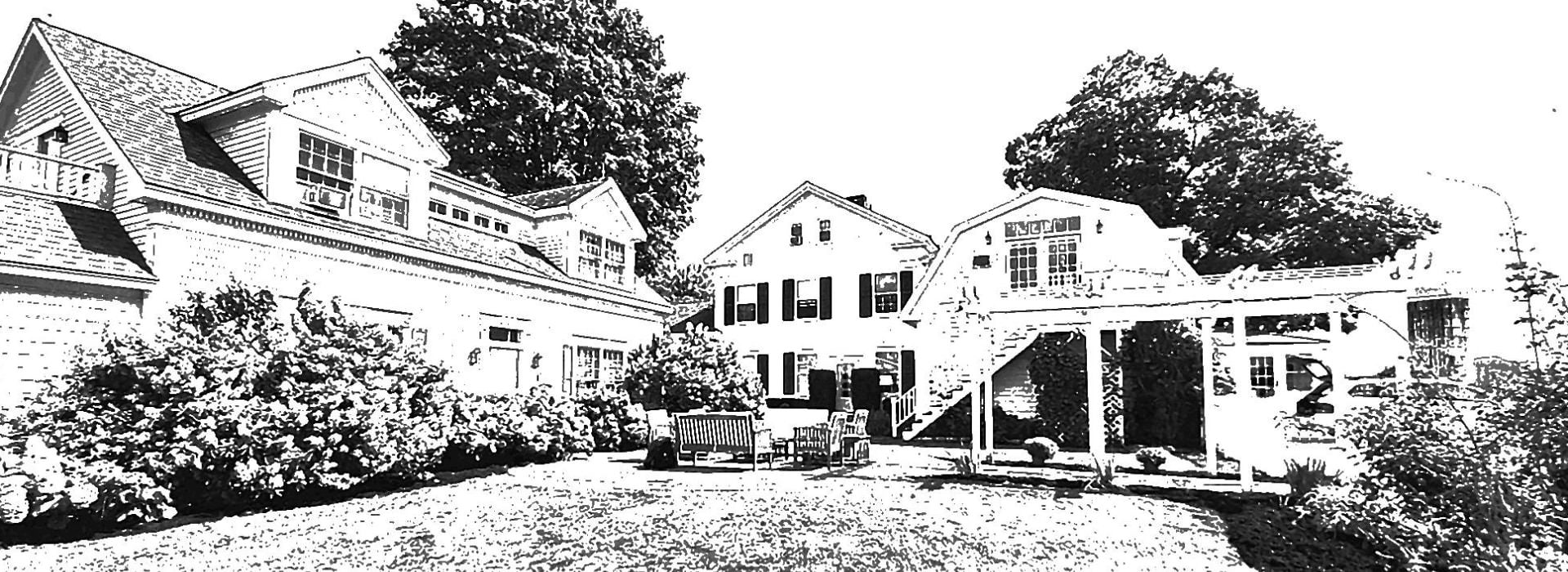 Black and white sketch of a large house with a carriage house, covered walkway and outdoor seating area.
